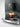 Jura C9 Piano Inox coffee machine brewing a rich espresso in a glass.